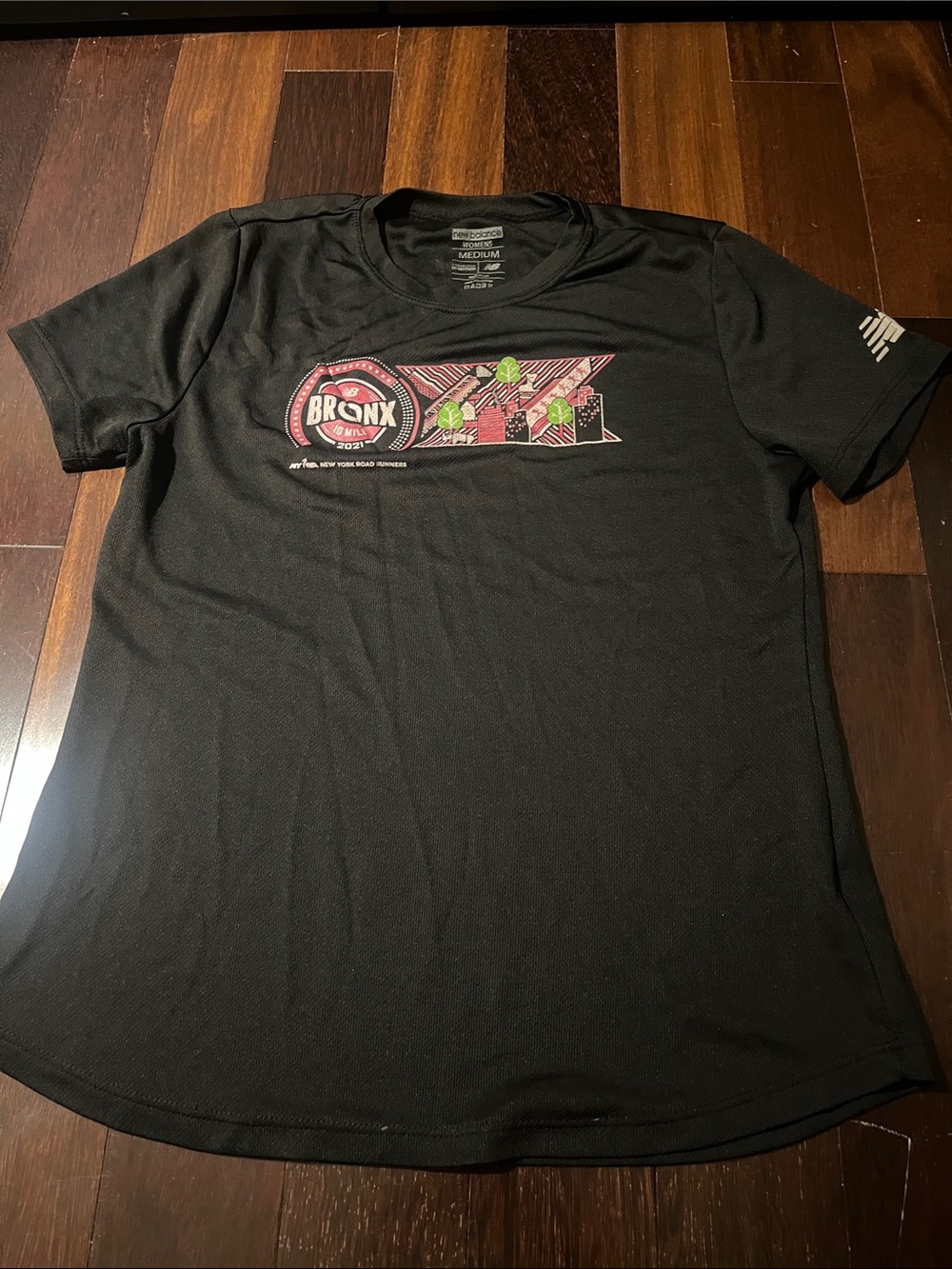 New Balance Black Short-Sleeve Graphic Tee with Pink & Green Accents